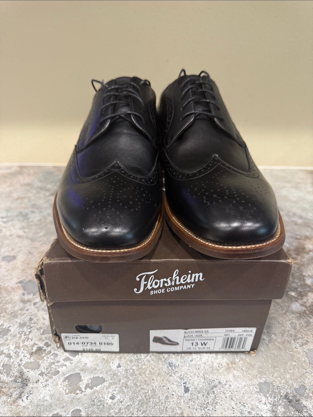 Florsheim Black Leather Wingtip Oxfords with Brown Welt Trim